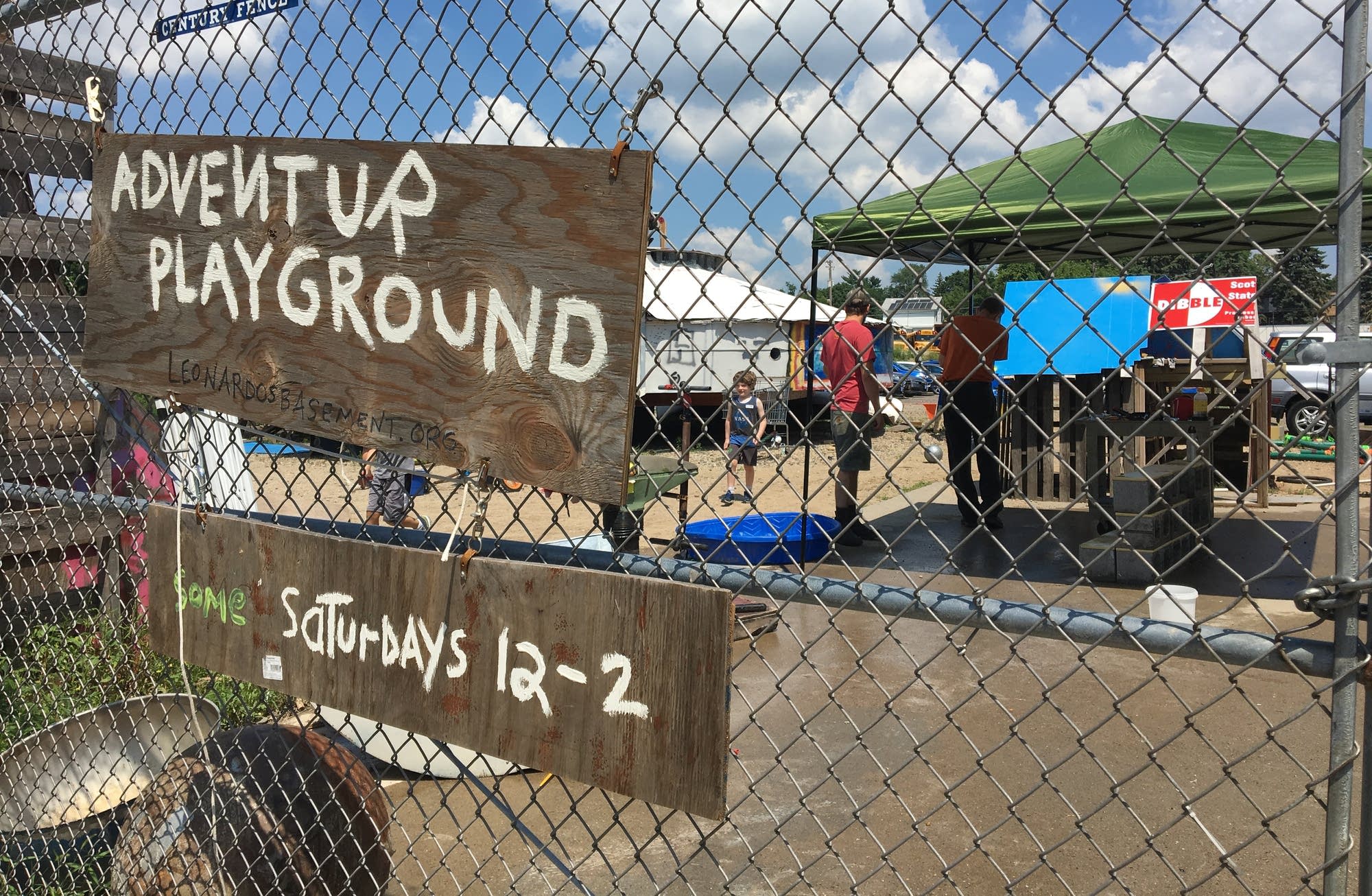 The Adventure Playground lies behind a chain-link fence in Mpls.