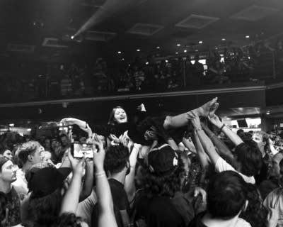 Person crowd surfing