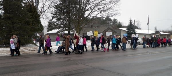 Demonstrators march in Longville