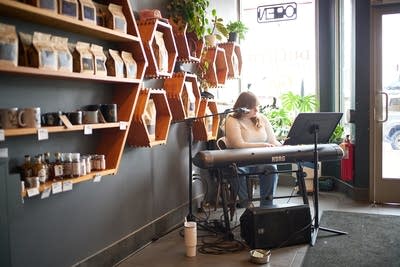 A musician plays piano at a coffeehouse