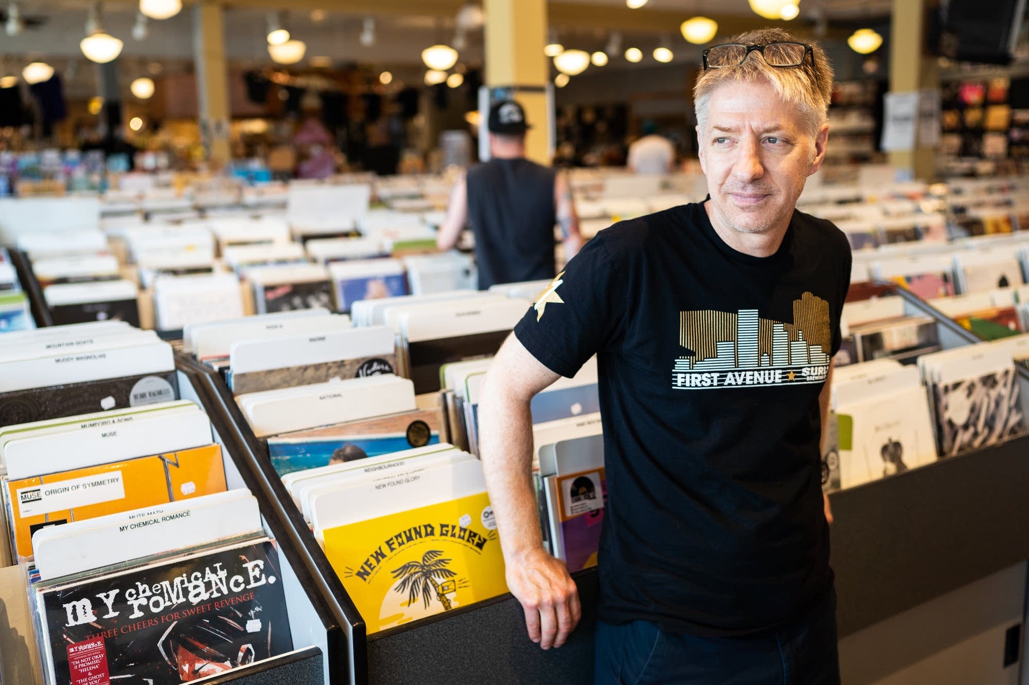 Electric Fetus retail music manager Bob Fuchs stands for a portrait.