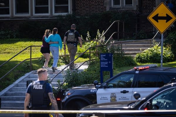 Two people hold each other