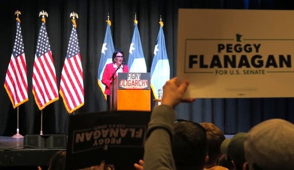 A woman speaks on stage