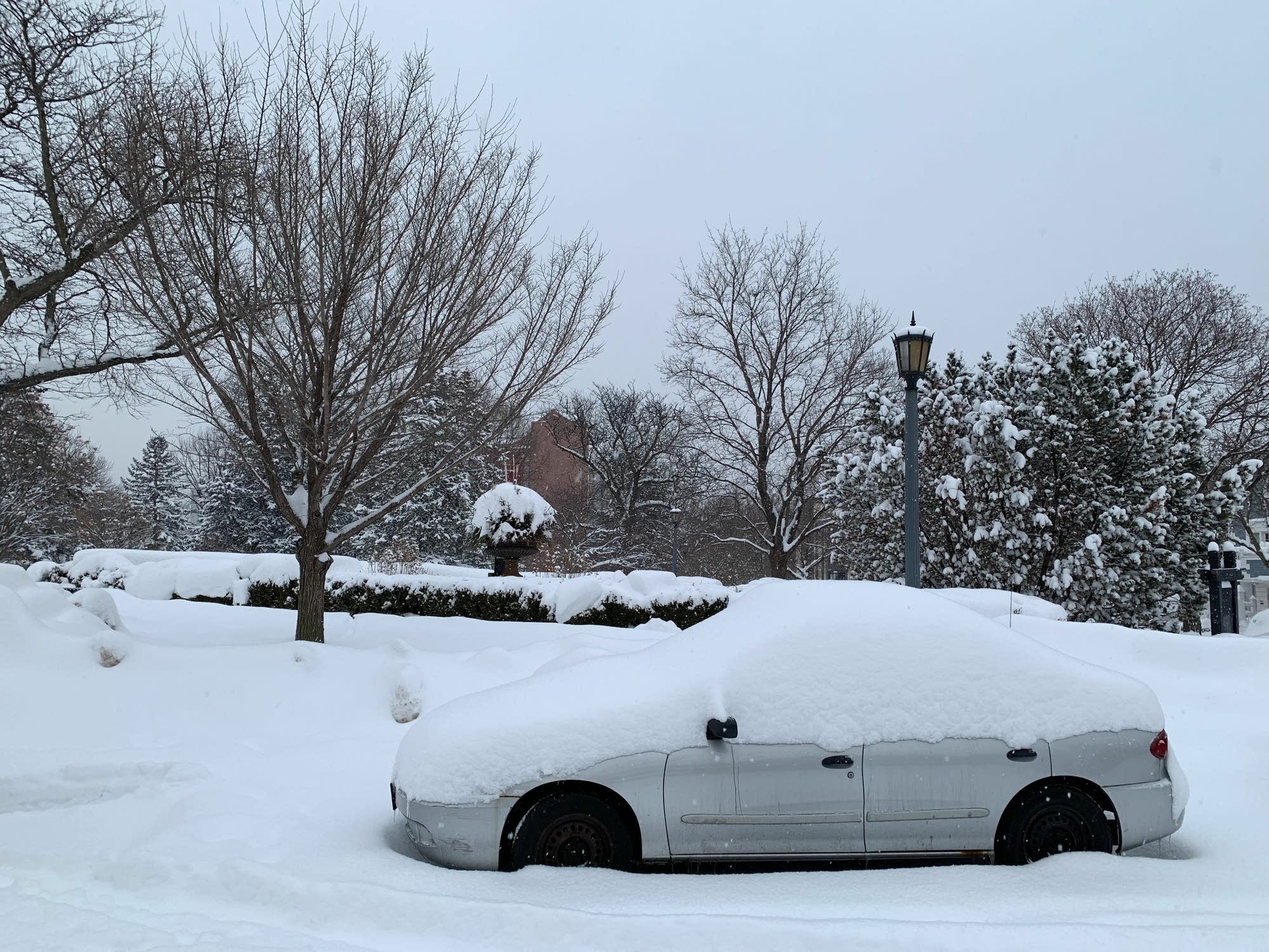 A car is parked on a street in Minneapolis Wednesday.