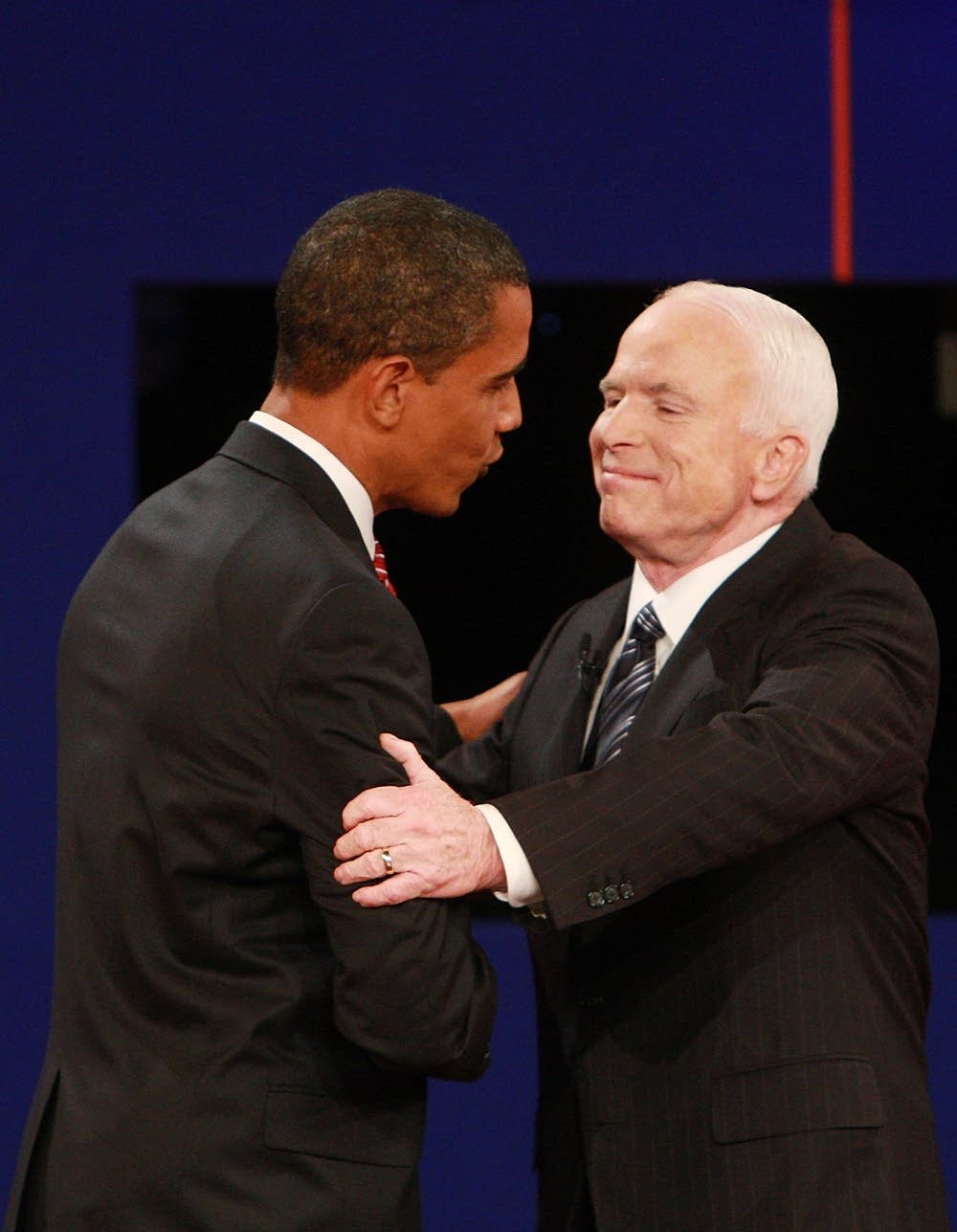 The candidates greet each other on stage