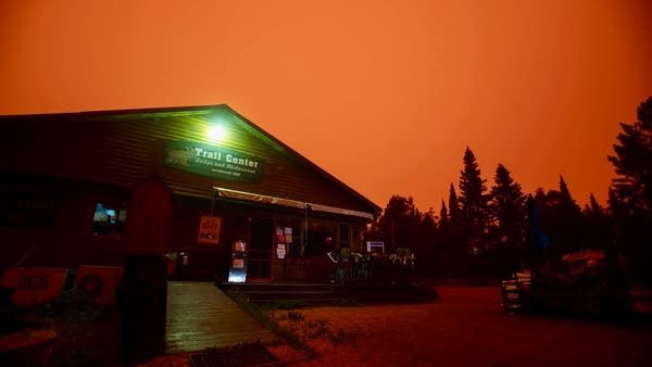 Wildfire smoke casts an orange hue over northern Minnesota landscapes