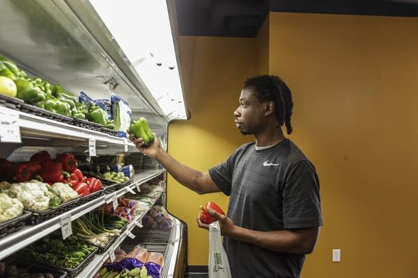 Emmett Hutchinson picks out the perfect pepper.