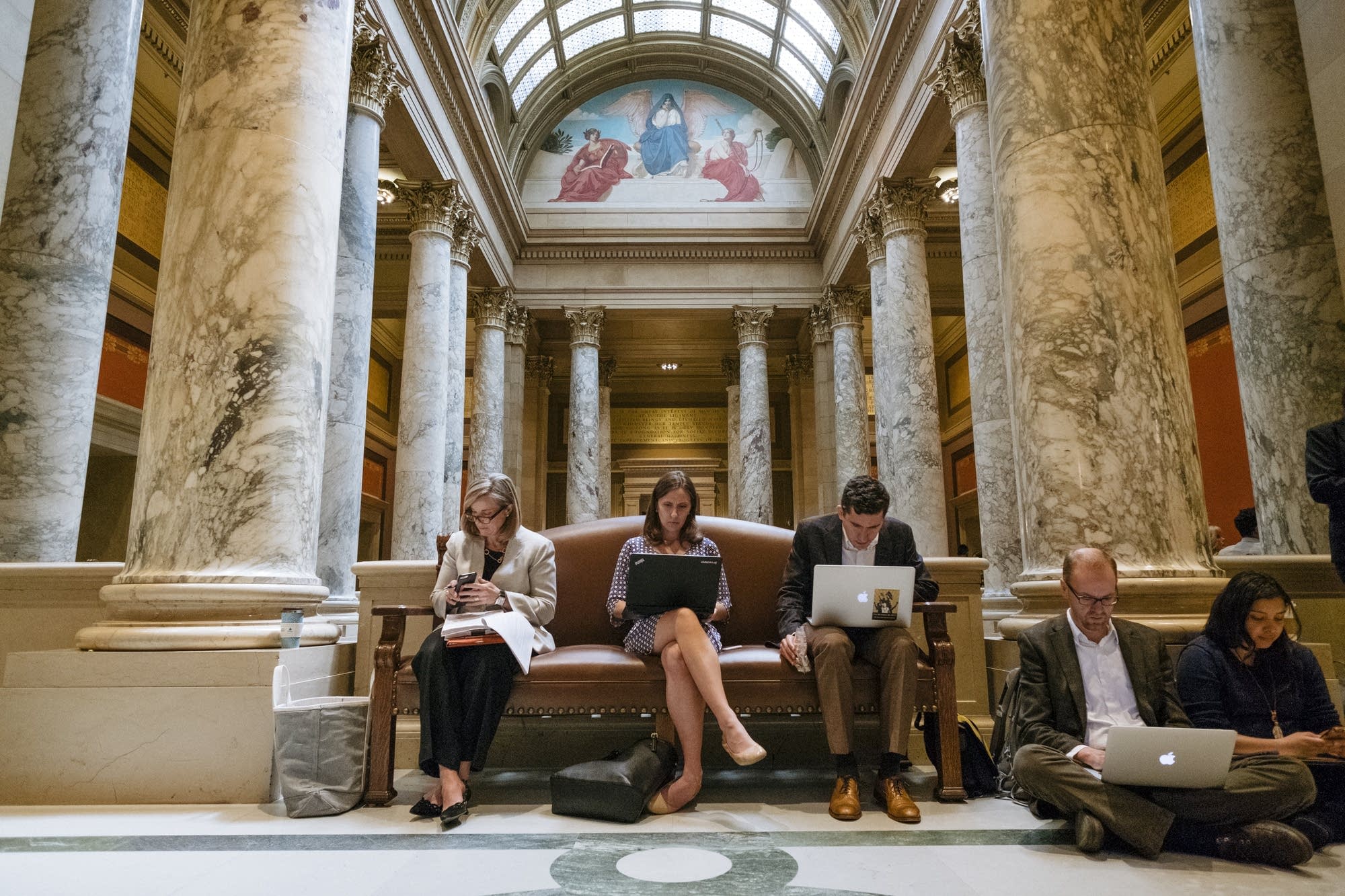 People get to work inside the Capitol.