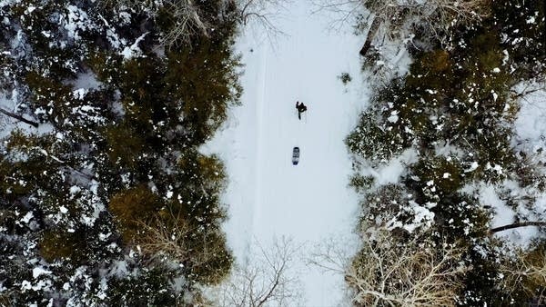 An image of someone running in the snow