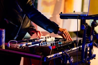 Two hands make beats onstage in a nontraditional music venue