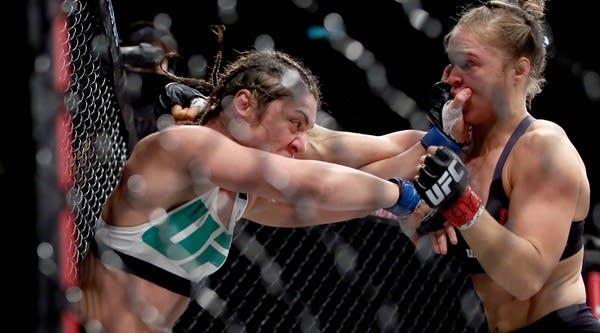Ronda Rousey of the United States (red) defeats Bethe Correia of Brazi (blue) during a UFC match on August 1, 2015 in Rio de Janeiro, Brazil.