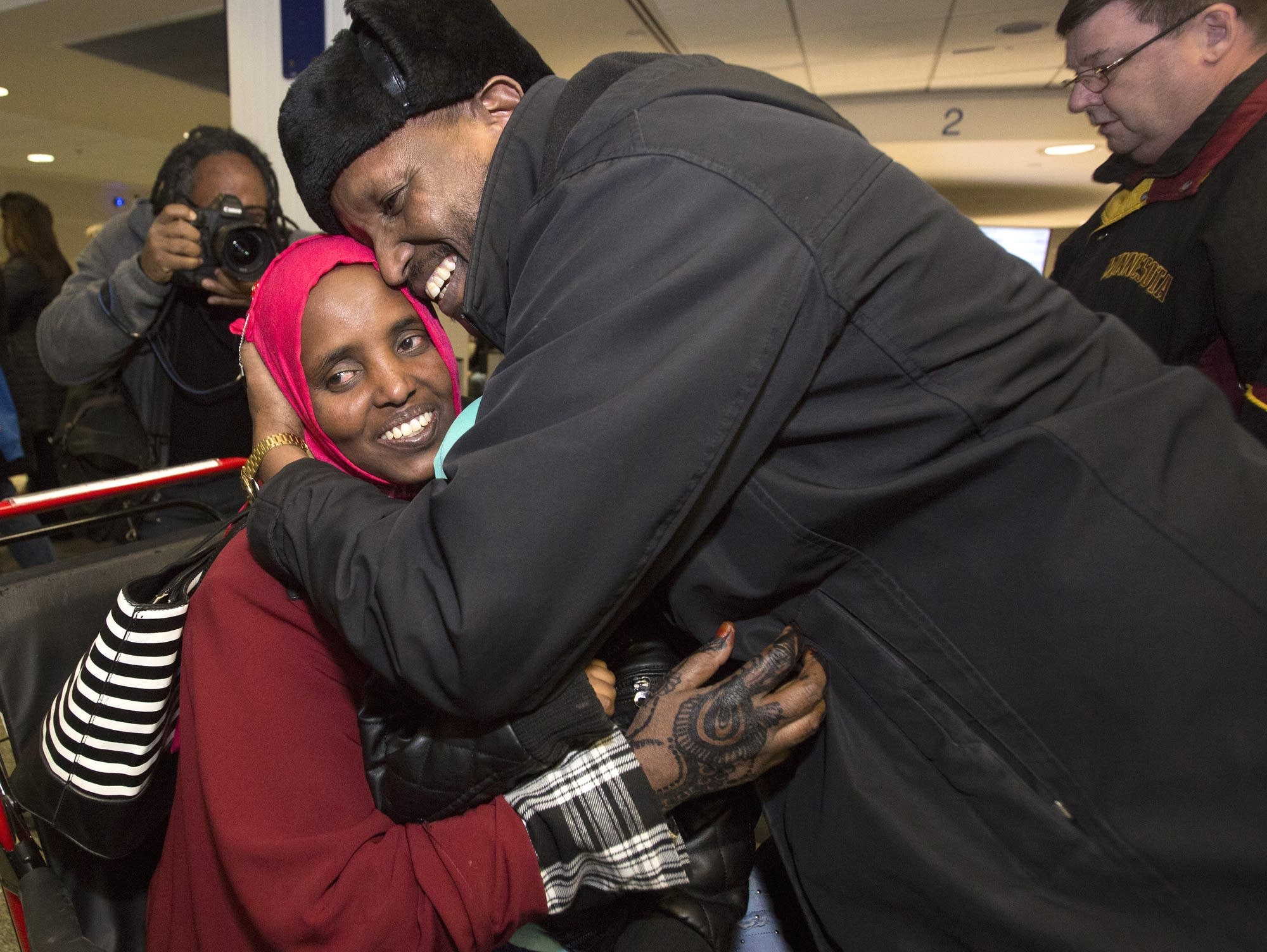 Mahamed Iye hugs his wife Saido Ahmed Abdille