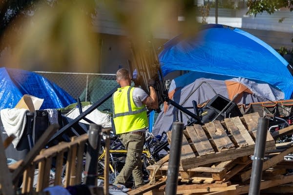 person clearing things outside