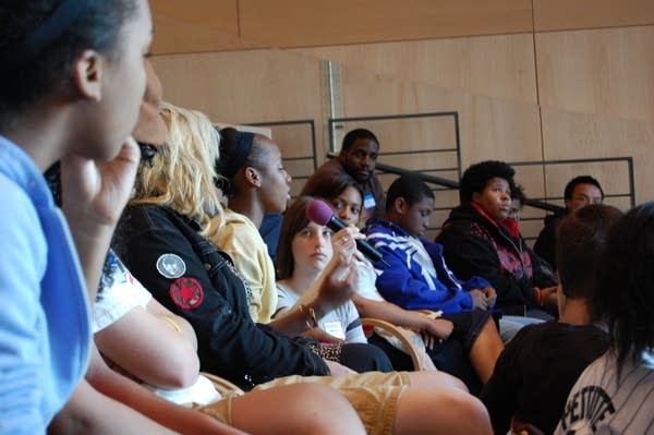 A young woman speaks at MPR's UBS Forum