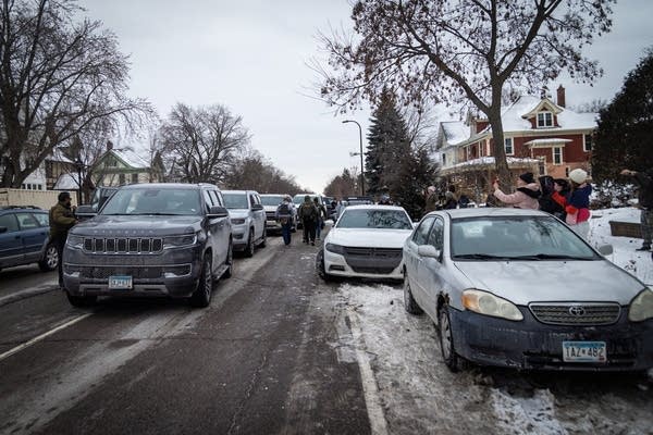 Federal agents walk back to their cars