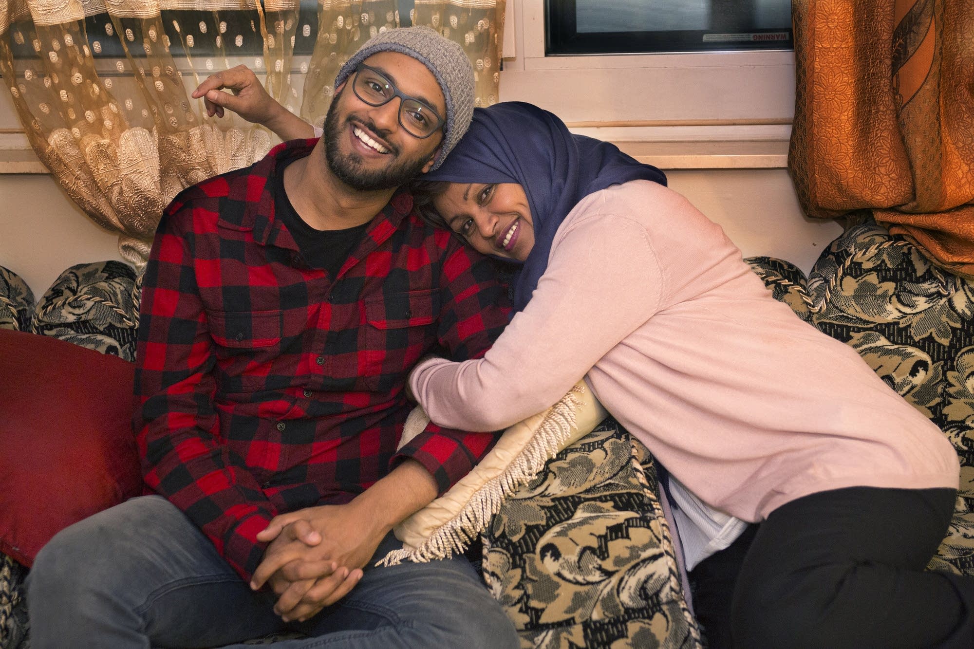 Ali Sultan of Minneapolis sits with his mother, Mona Shamsan.