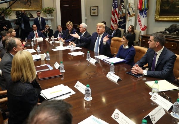 President Donald Trump and Vice President Mike Pence participate in a coronavirus briefing with health insurers in the Roosevelt Room at the White House on Tuesday.