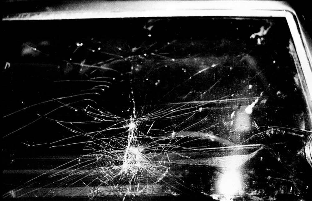 Shattered windshield of squad car