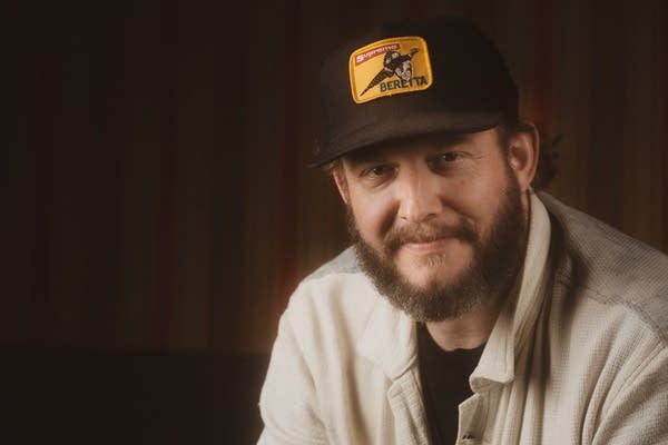 Justin vernon posing for photos