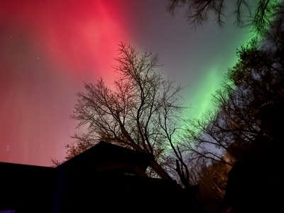 Red and green lights cover the night sky.