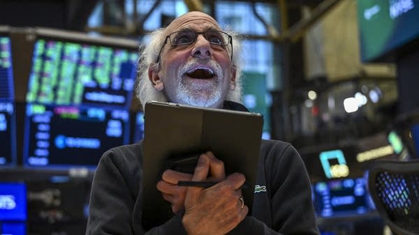Traders work the floor of the New York Stock Exchange.