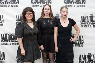 Three women pose for a photo together