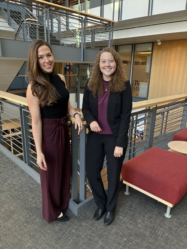 two women pose for a portrait