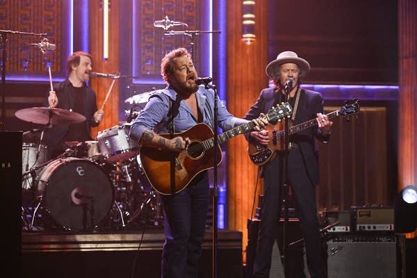 A band performing on a television soundstage