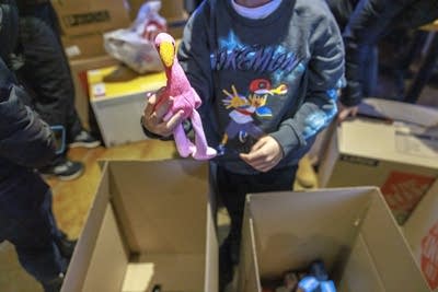 Pamir, 8, delivers a stuffed toy