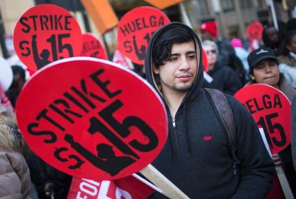 Demonstrators demanding an increase in the minimum wage to $15-dollars-per-hour prepare to march in the streets on April 14, 2016 in Chicago, Illinois.