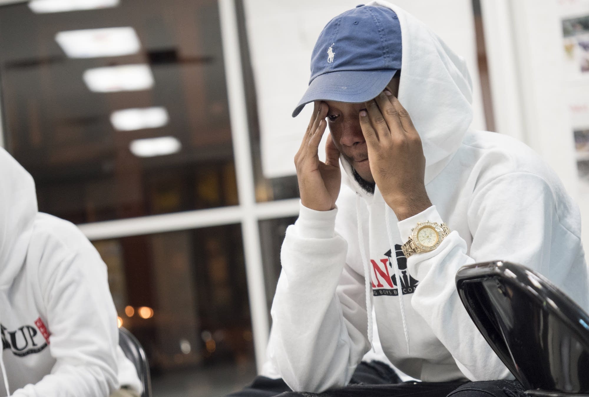 Kerrionte Fair, 16, strives to hold back his emotions.