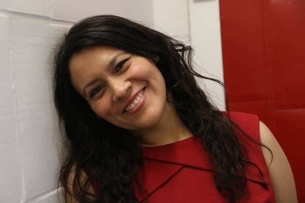 a woman poses for a photo