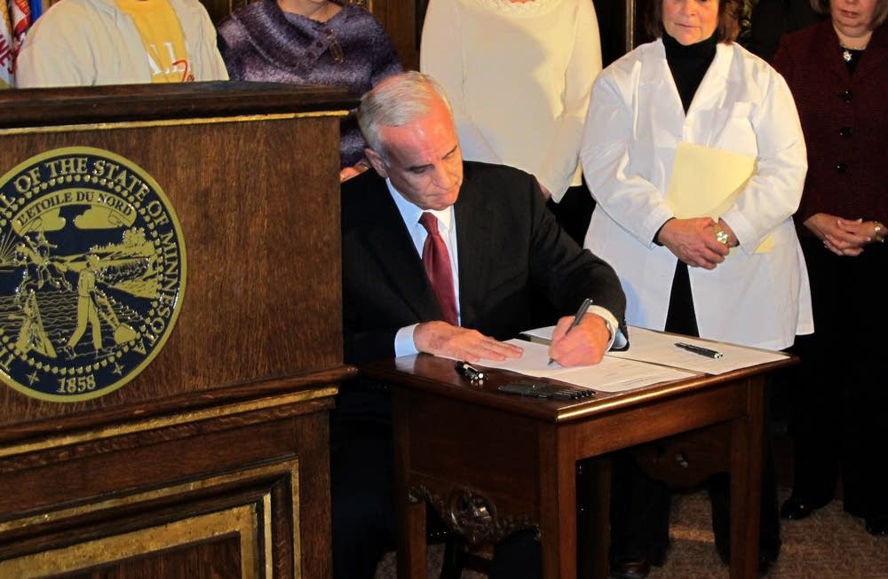 Dayton signing Medicaid expansion