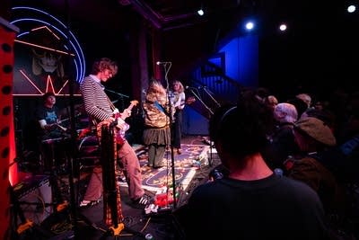 Band performing on stage and crowd watching