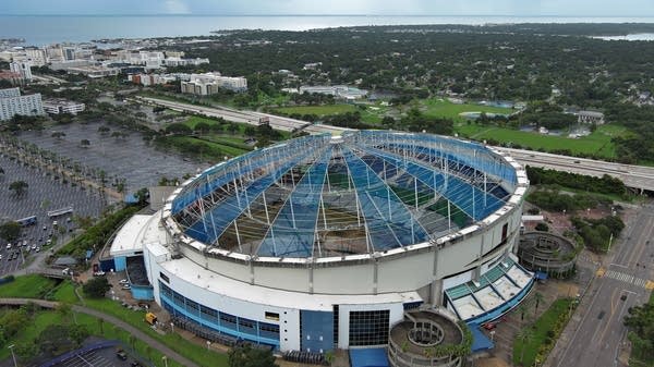 An aerial view of Tropicana Field and stadium dome damage from Hurricane Milton on Aug. 25, 2025, in St. Petersburg, Florida.