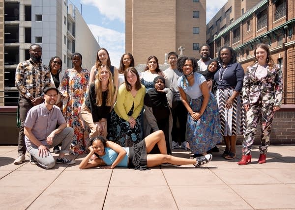 a group of people taking a photo together