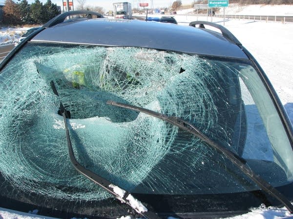 Pickup driver picks an inopportune time to lose control on icy highway