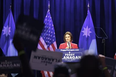 A woman talks at a podium-2
