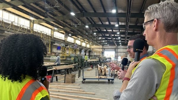 Richardson and Ryssdal with Joe Cranford at Sunpro's truss manufacturing plant. 