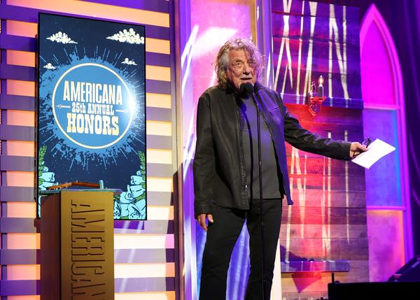 A man gives a speech onstage