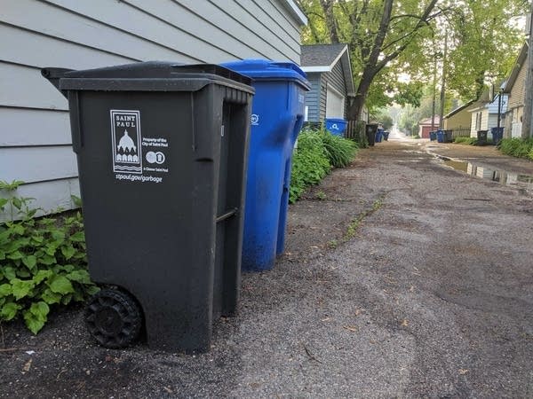 Trash carts line an alley in St. Paul.