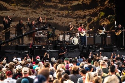 Nathaniel Rateliff and his band performing on stage