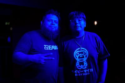 two attendees of watch party pose for photo