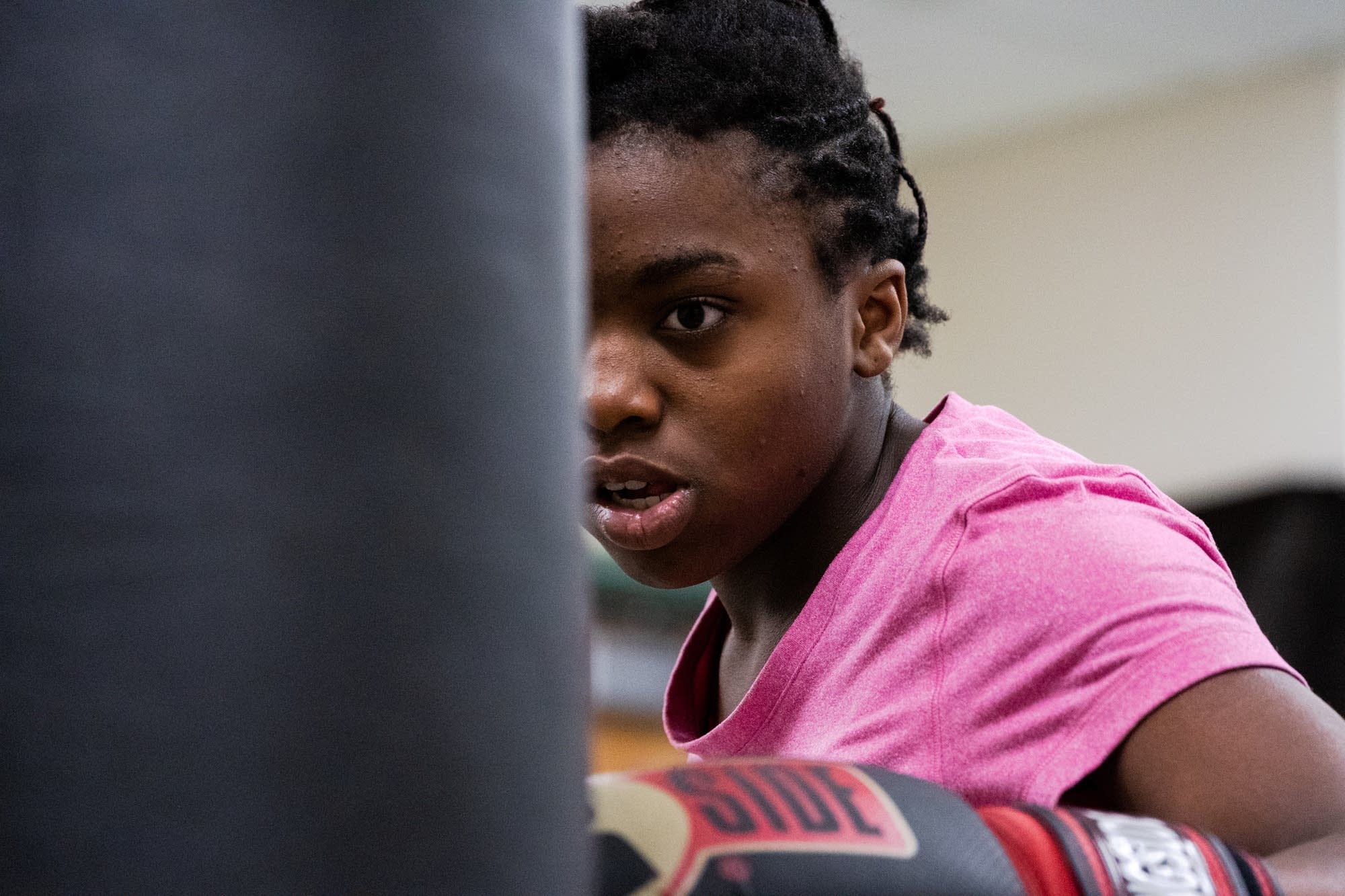 Fifth-grader Alexis hits a punching bag.