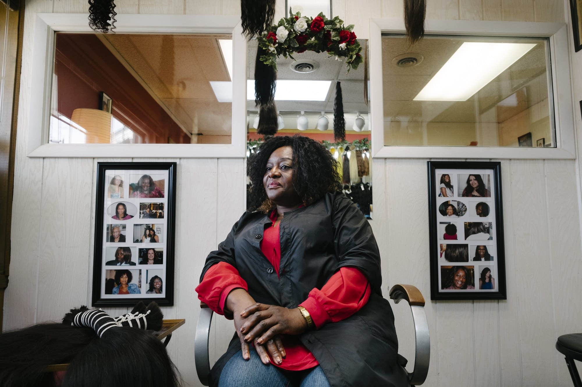 Pampered Hair Haven owner Joyce Iyawe sits for a portrait.