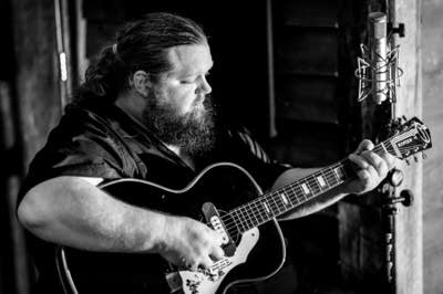 A man playing a guitar