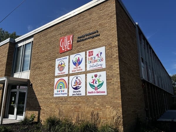 Exterior shot of the CLUES Center's light brick building.