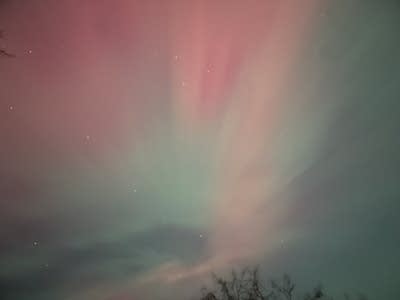 Red and green lights cover the night sky.