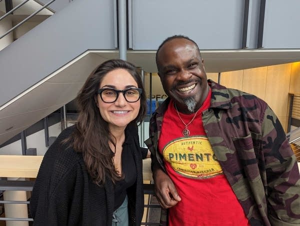 two people smiling and posing for a photo