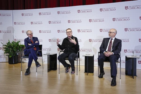 University of Chicago professor James A. Robinson (C) speaks next to University of Chicago President Paul Alivisatos (L) and Dean of Harris school of Public Policy Studies Ethan Bueno de Mesquita (R) during a news conference at the David Rubenstein Forum in Chicago, Illinois on October 14, 2024.